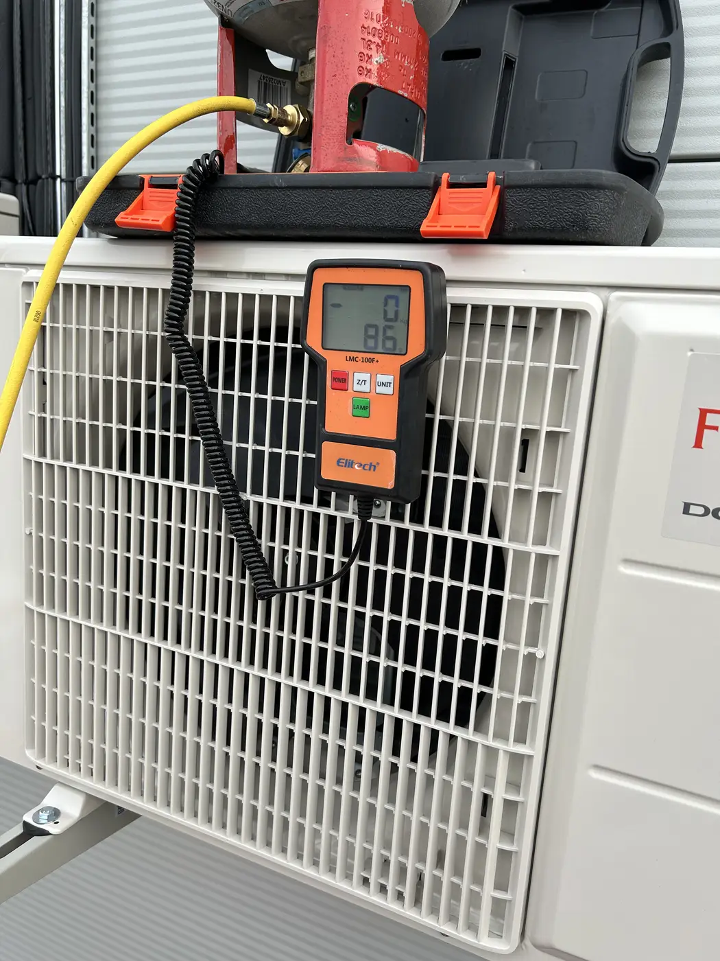 Outdoor air-conditioning unit being serviced